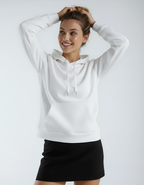 Smiling woman in the white Heavyweight Pullover Hood P2016, a premium fleece hoodie from Callahans store, with a black skirt.